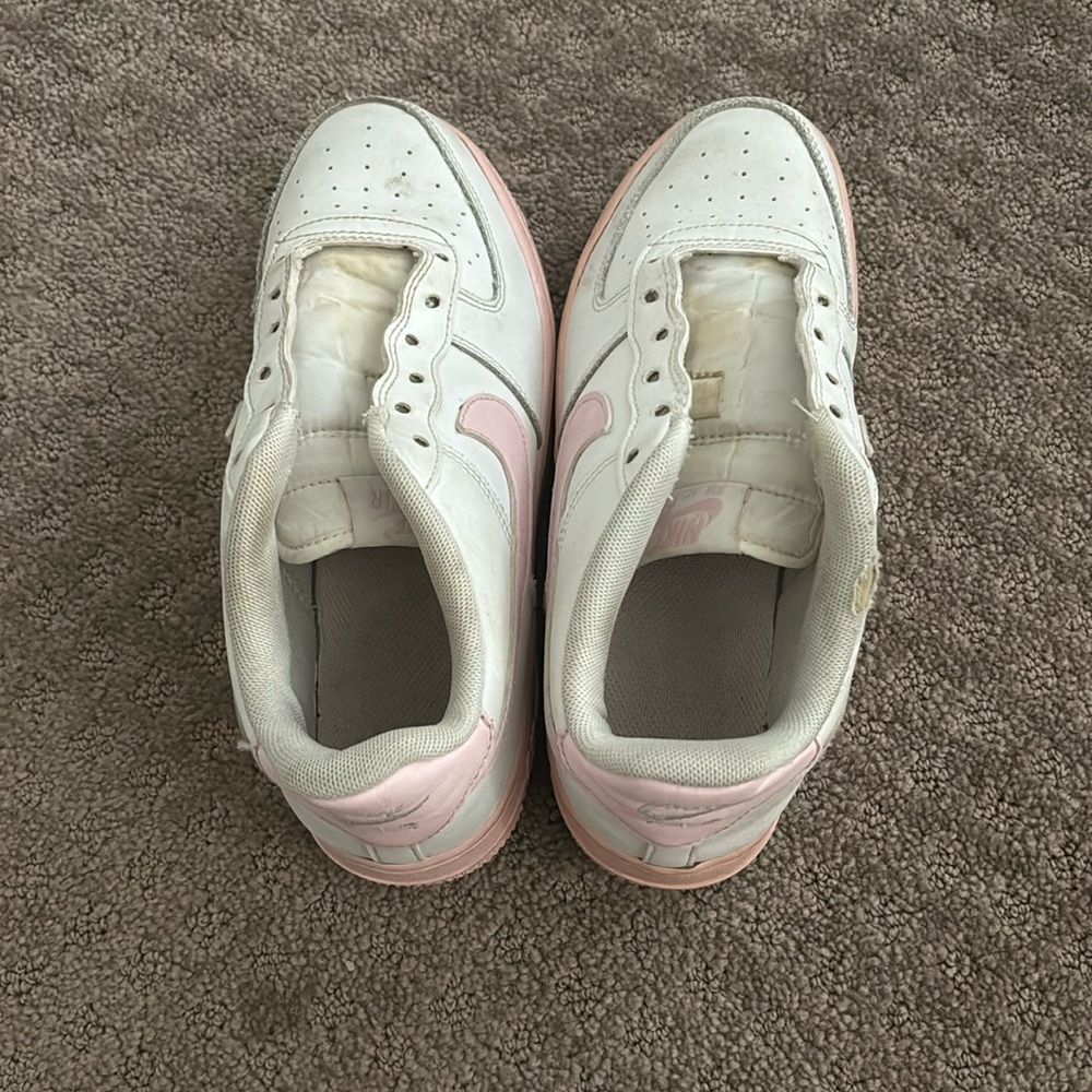Air force ones with pink swoosh